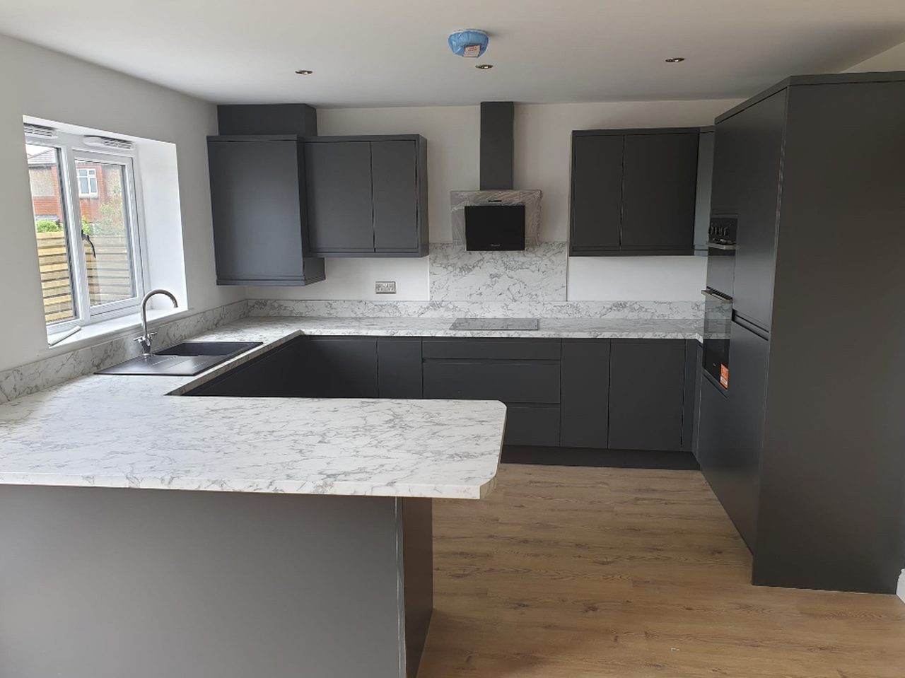 Modern grey handleless kitchen, Greater Manchester